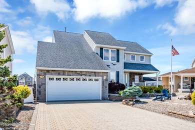 Welcome to 26 Jib Court, a spectacular waterfront retreat tucked - photo 2