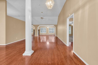 Nestled beneath mature oaks, this custom all-brick home offers a - photo 2
