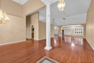 Nestled beneath mature oaks, this custom all-brick home offers a - photo 3