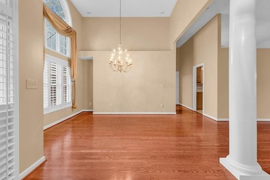 Nestled beneath mature oaks, this custom all-brick home offers a - photo 4