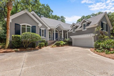 Tucked behind mature canopy on a rare, private one acre double - photo 2