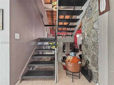 Tucked behind a private, palm-lined entrance in sought-after - photo 14