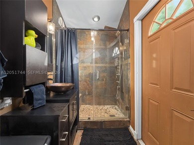 Tucked behind a private, palm-lined entrance in sought-after - photo 28