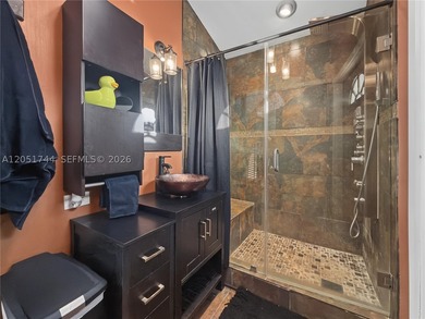 Tucked behind a private, palm-lined entrance in sought-after - photo 29