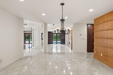 Set along the fairways of Pine Tree Golf Club, this fully - photo 32