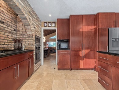 Tucked behind a private, palm-lined entrance in sought-after - photo 34