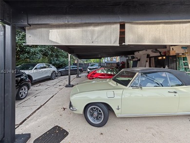 Tucked behind a private, palm-lined entrance in sought-after - photo 40