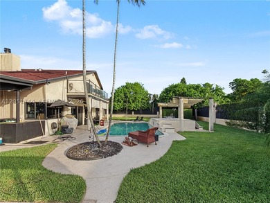 Tucked behind a private, palm-lined entrance in sought-after - photo 41