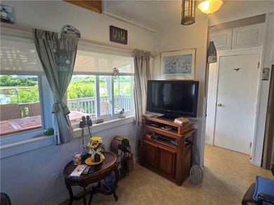 Rare 3 bed 1 bath waterfront cottage on Potter Pond!!! Located - photo 8