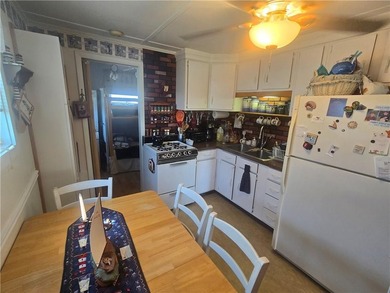 Rare 3 bed 1 bath waterfront cottage on Potter Pond!!! Located - photo 9