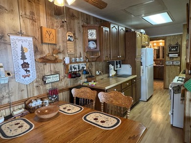 MOTIVATED SELLER - A dollhouse cottage right at the water's edge - photo 10