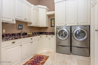 Tucked away on a private, tree-lined lane in Holladay, this - photo 49