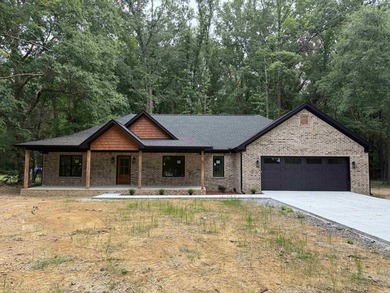 New construction home nestled on a private, wooded lot offering - photo 1