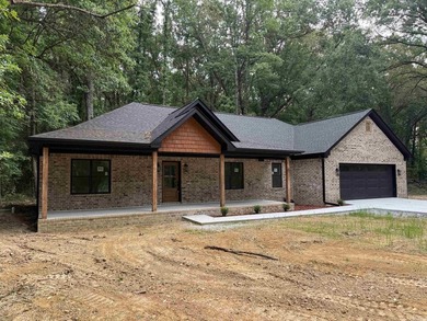 New construction home nestled on a private, wooded lot offering - photo 2
