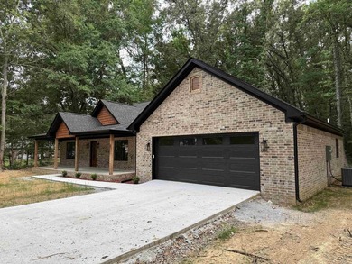 New construction home nestled on a private, wooded lot offering - photo 3