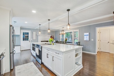 Lovingly updated with a fresh coastal-inspired aesthetic, this - photo 8