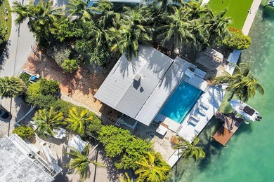 Welcome to 166 Bayview Drive, a rare bayfront estate in the - photo 3