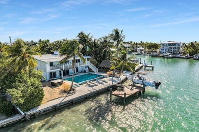 Welcome to 166 Bayview Drive, a rare bayfront estate in the - photo 10