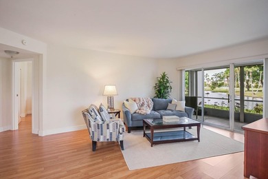 WELCOME TO THIS VERY DESIRABLE CORNER CONDO WITH BEAUTIFUL WATER - photo 2