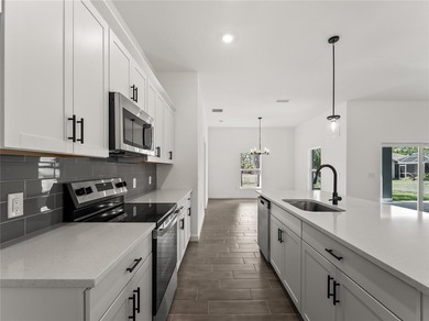 Tile throughout. Quartz countertops. Impact windows. Paver - photo 7