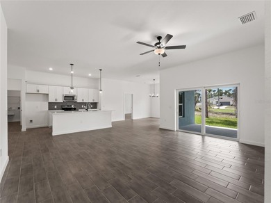 Tile throughout. Quartz countertops. Impact windows. Paver - photo 10