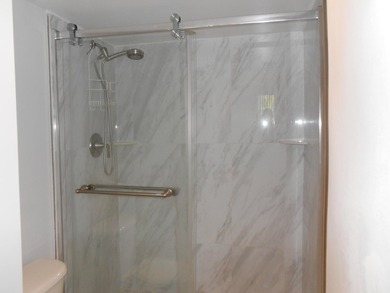 This 3-bedroom, 2-bath home includes a detached garage. Step - photo 5
