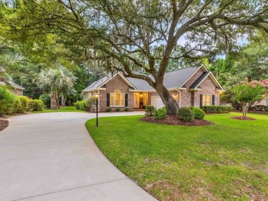 Tucked inside Heritage Plantation, this three-bedroom, two-bath - photo 1