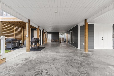 Welcome to 7605 East Yacht Drive NE in Oak Island, North