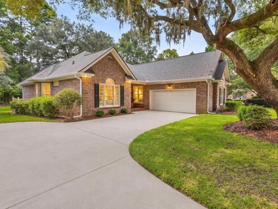 Tucked inside Heritage Plantation, this three-bedroom, two-bath - photo 2