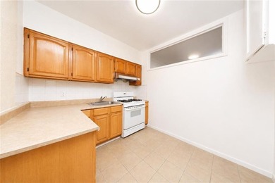 Welcome to this well-maintained attached brick two-family home - photo 12