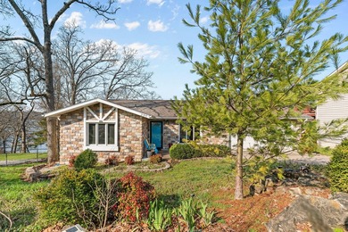 Experience true lakefront living on Table Rock Lake, just - photo 2