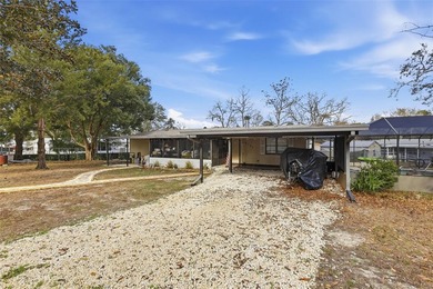 Set on just over half an acre, this 1989 double-wide mobile home - photo 4