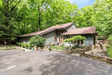 Set on nearly 6 wooded acres, this contemporary custom home - photo 2