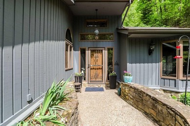Set on nearly 6 wooded acres, this contemporary custom home - photo 3