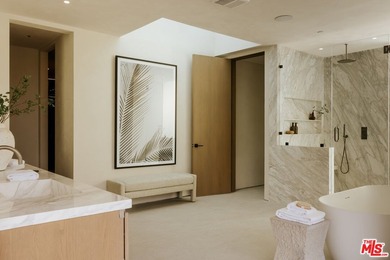 A dual-entry motor court paved in stone sets the stage for - photo 16