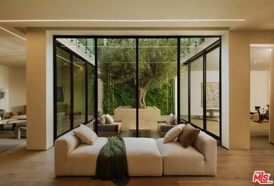 A dual-entry motor court paved in stone sets the stage for - photo 21