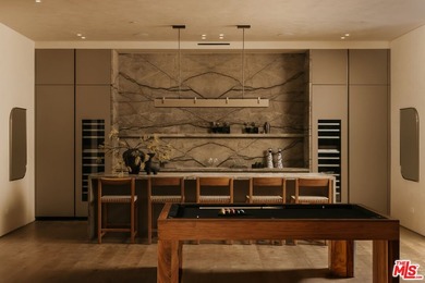 A dual-entry motor court paved in stone sets the stage for - photo 26