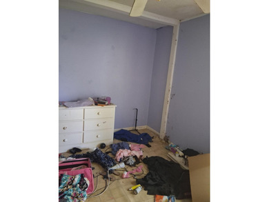 This 4 bedroom 2 bath home is sold AS-IS without appliance and - photo 6