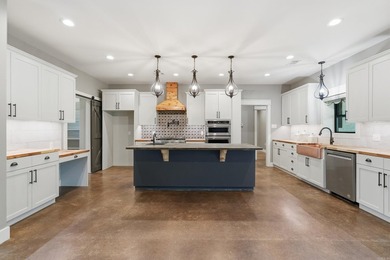 What a unique property! Situated on 2.24 acres just outside the - photo 6