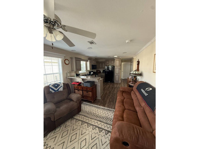 This home is situated in Buttonwood Village, an upscale 55+ - photo 3