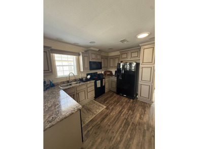 This home is situated in Buttonwood Village, an upscale 55+ - photo 5