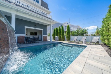 Situated on a 60'x110' lot in the south end of Avalon, this Tom - photo 35