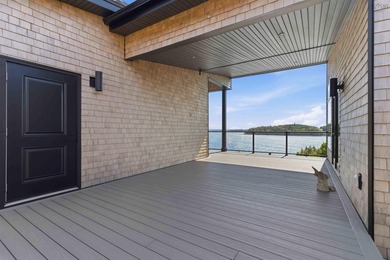 Discover unparalleled coastal living at 42 Shore Road, a - photo 4