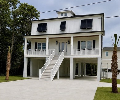 Experience the ultimate coastal lifestyle in this stunning new - photo 1