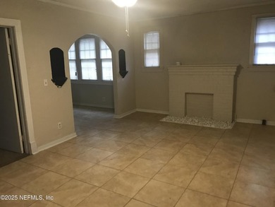 This is a 3 bedroom 1 bath home. It has tile in the living room - photo 5