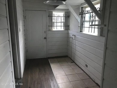 This is a 3 bedroom 1 bath home. It has tile in the living room - photo 8