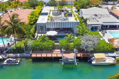 Located within a 24/7 guarded waterfront enclave and less than - photo 4
