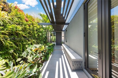 Located within a 24/7 guarded waterfront enclave and less than - photo 6