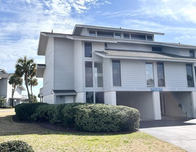 Discover the epitome of coastal elegance at 103 Inlet Point - photo 1