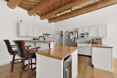 Explore this custom pueblo home with an open floor plan! Light - photo 22
